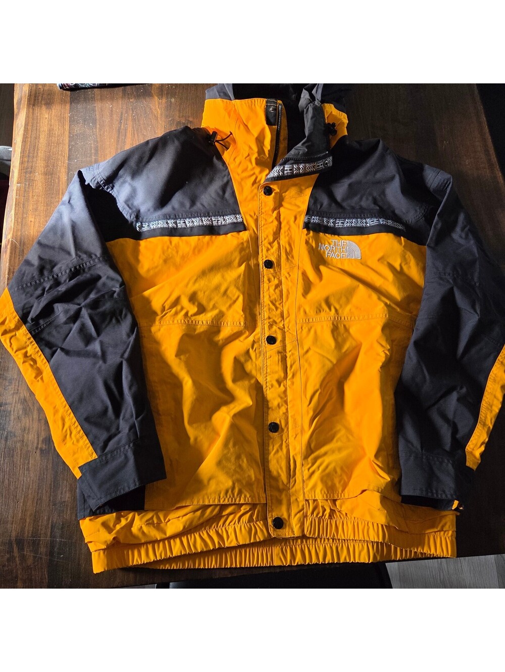 The North Face yellow black hooded jacket size Large